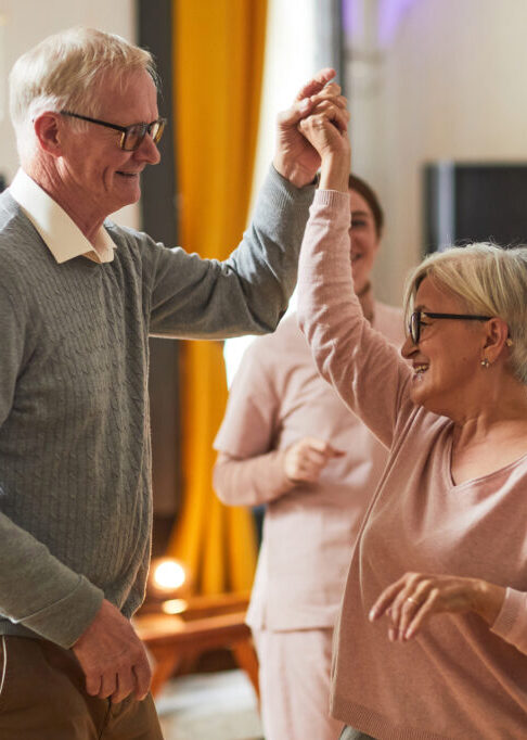 Senior People Dancing in Retirement Home