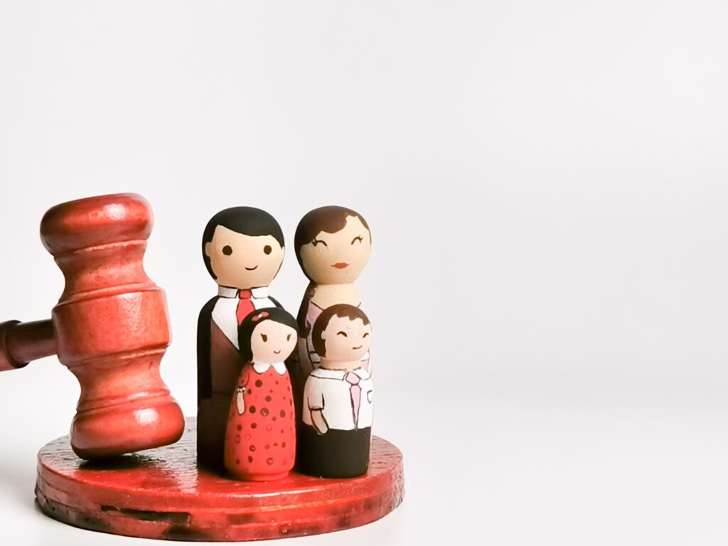 family-law-concept-wooden-dolls-family-with-gavel